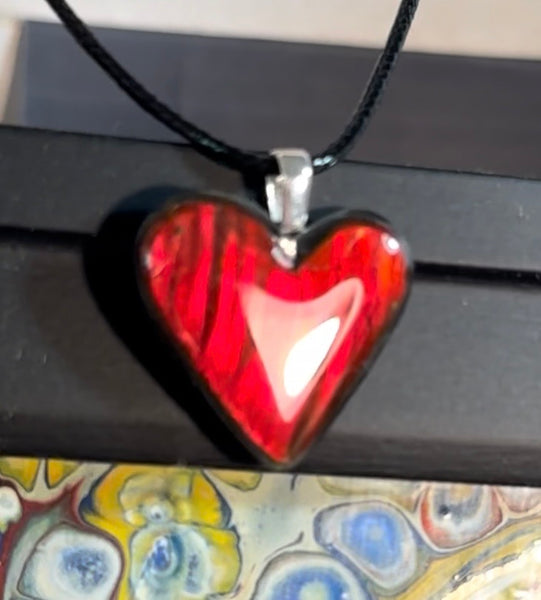 Heart shaped bright red ammolite pendant With a Sterling Silver .925 feather bail