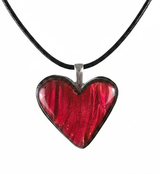 Heart shaped bright red ammolite pendant With a Sterling Silver .925 feather bail