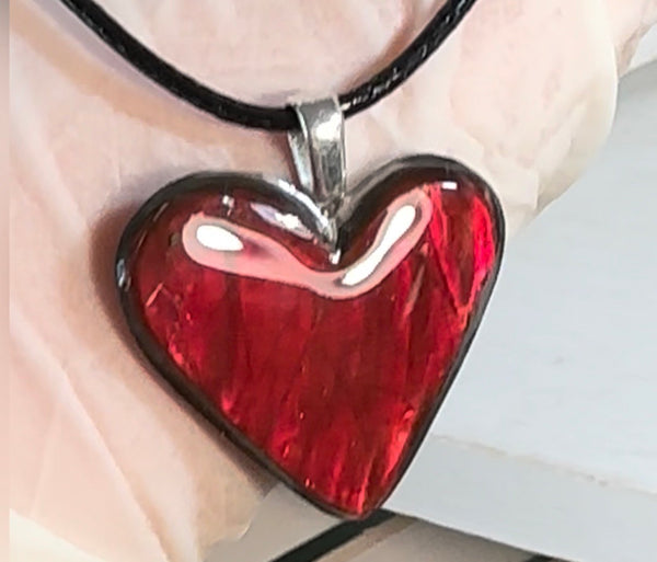 Heart shaped bright red ammolite pendant With a Sterling Silver .925 feather bail
